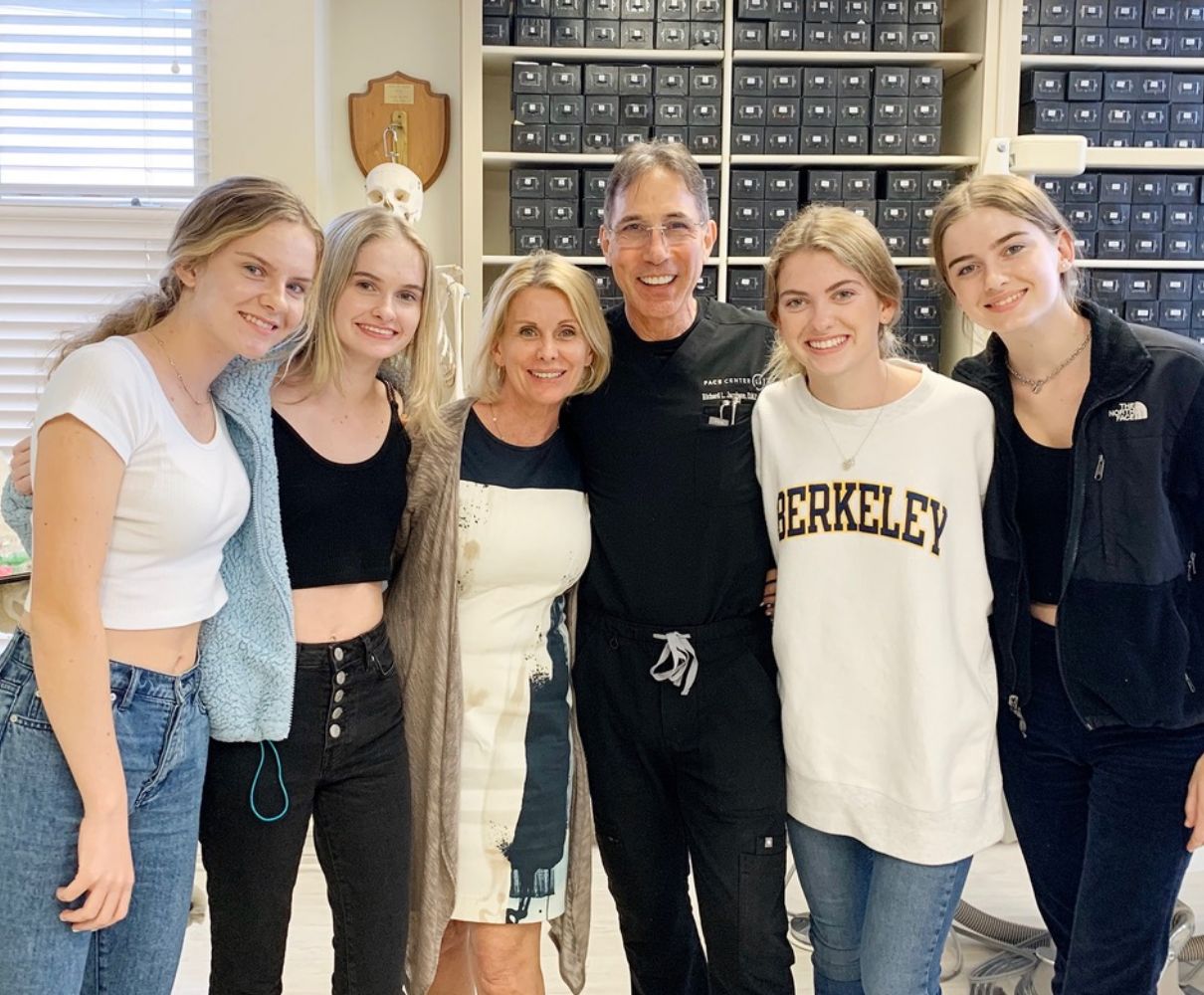 the quadruplets with their mom and Dr. Jacobson, now in college